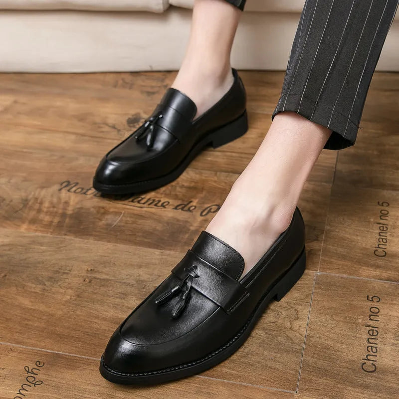 Men's black slip-on business casual shoes with tassel detail and rubber sole