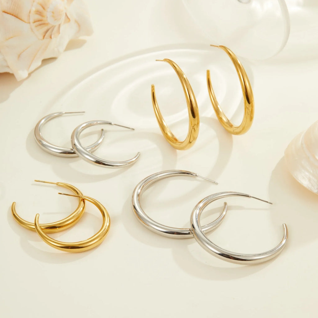 Simple geometric round hoop earrings in gold and steel finish made of stainless steel with 18K PVD plating