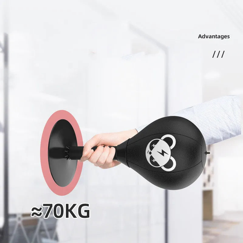 Tabletop boxing speed ball with suction cup base and PU leather inflatable sphere on a desk.