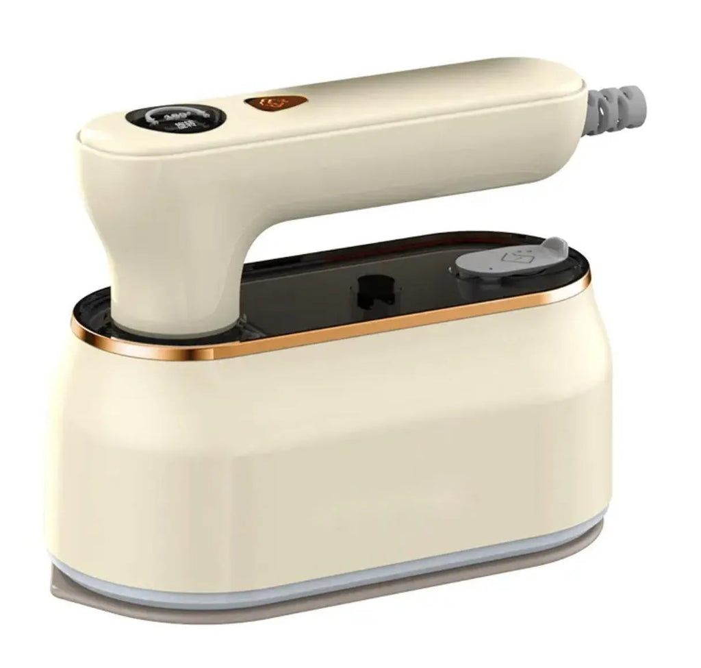 Light purple foldable portable travel iron with a ceramic soleplate on a white background.