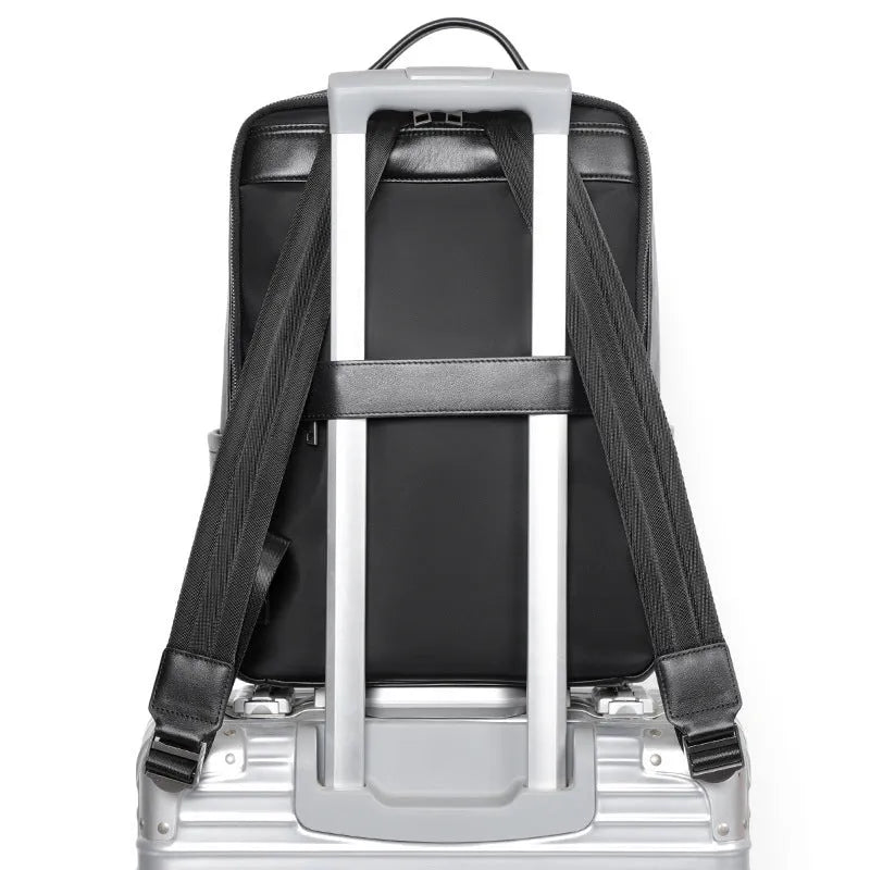 Large black genuine leather men's backpack with woven detail and a curved back panel.