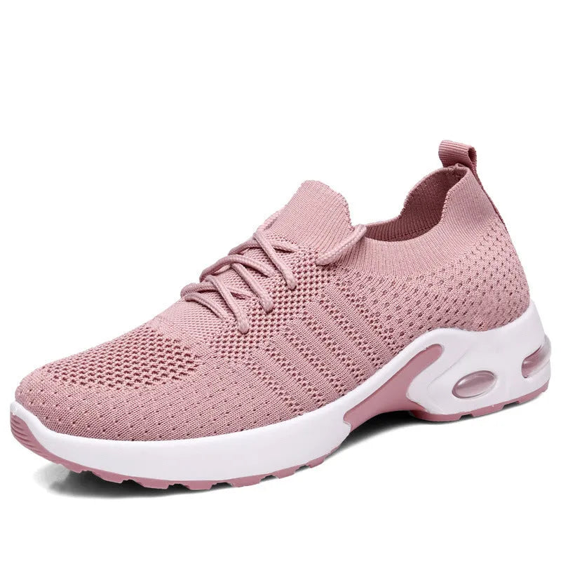 Women's black casual sneaker with mesh upper, lace-up front, and soft PVC sole.