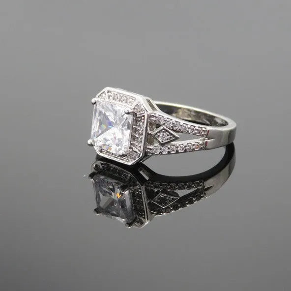 Women's platinum colour geometric zircon ring with hollow ornament design showing quadrilateral pattern
