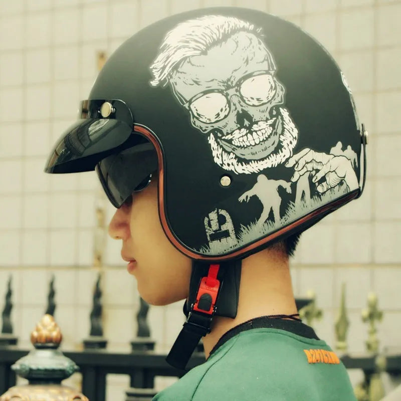 Retro-style half helmet for riding, shown in a selection of colours including black, grey, white, and orange on a neutral background.