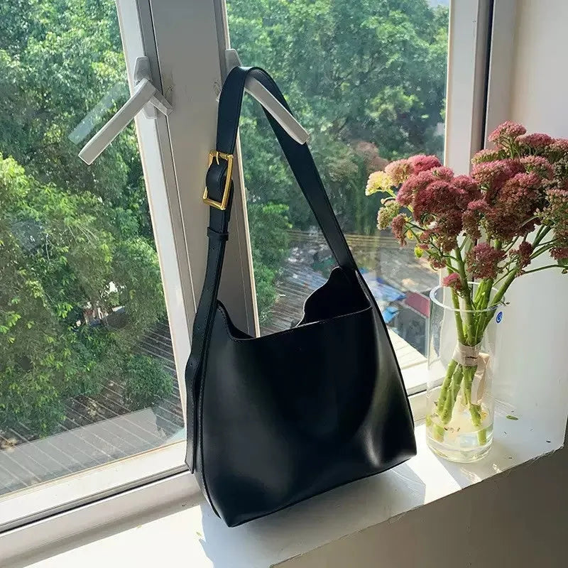 Women's soft PU shoulder bag with swing thread detail in black or brown colour