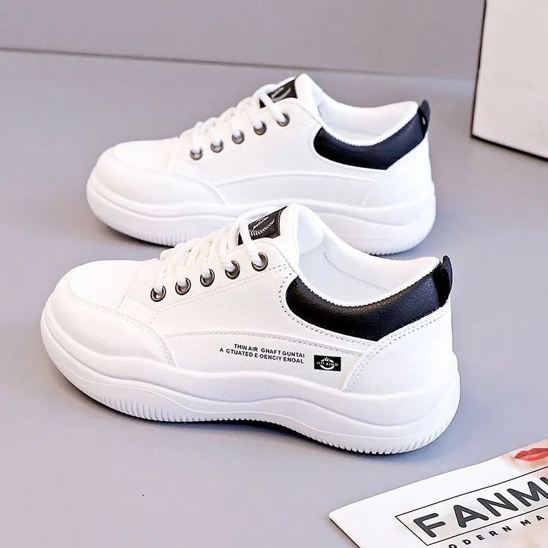 Women's white Korean-style low-top lace-up pumps with cross straps and a round toe.