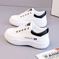 Women's white Korean-style low-top lace-up pumps with cross straps and a round toe.