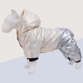 Green waterproof cotton-padded dog coat with four-legged design on medium-sized dog