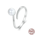 Adjustable S925 sterling silver ring with natural shell pearl elements and open loop design