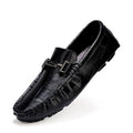 Men's black casual leather peas shoes with a belt buckle detail and flat rubber sole on a white background