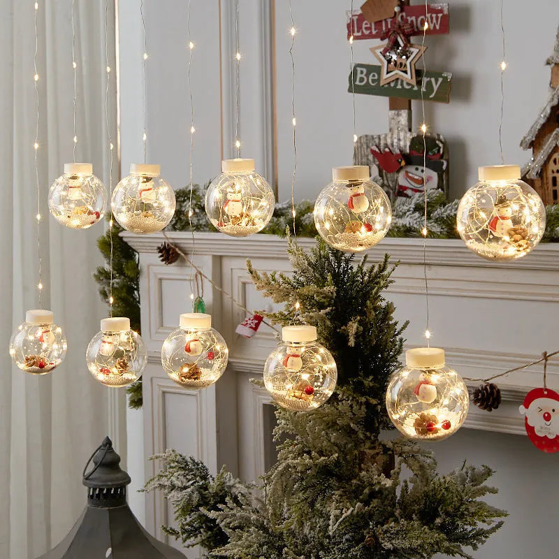 10-piece LED Christmas curtain lights with fairy ball lamps showing snowman, elder, and Christmas tree designs