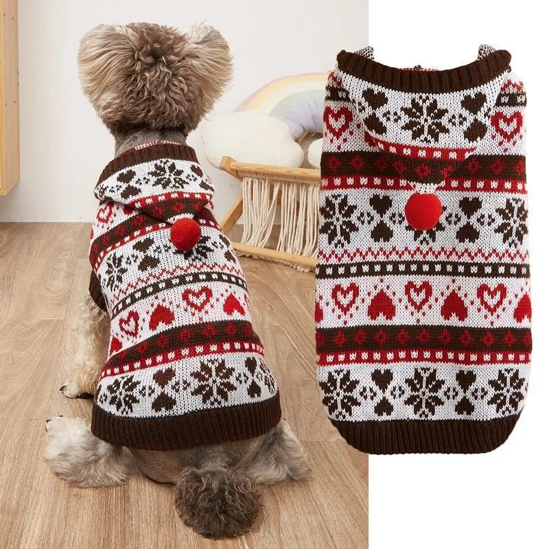 Pink knitted dog sweater with snowflake, love heart and stripe camouflage pattern on a small dog.