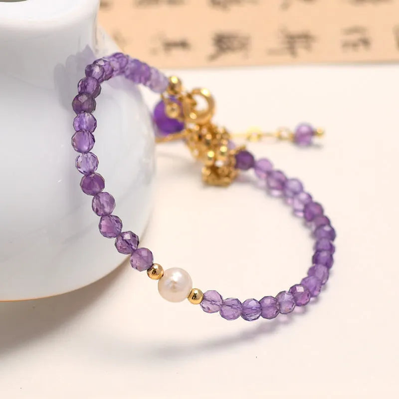 Amethyst-coloured crystal bracelet with diamond-shaped elements in Chinese style design
