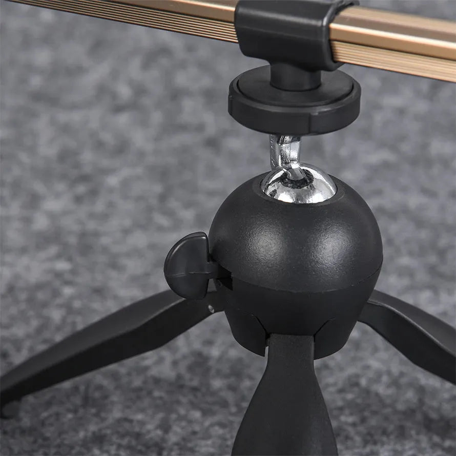Aluminum alloy ice fishing tripod rod holder bracket supporting a small fishing rod