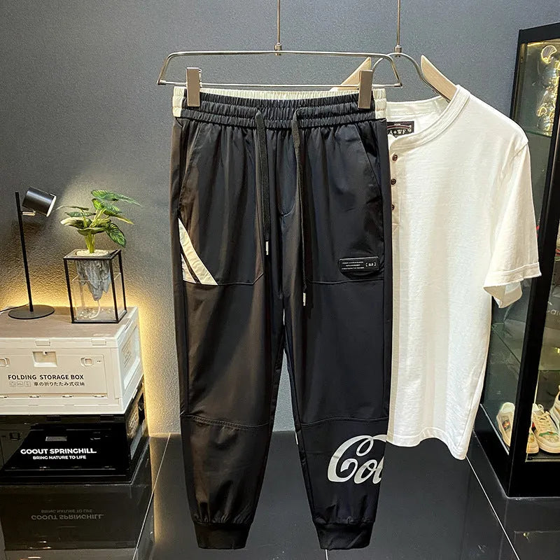 Black ultra-thin ice silk ankle banded cropped trousers for men displayed flat