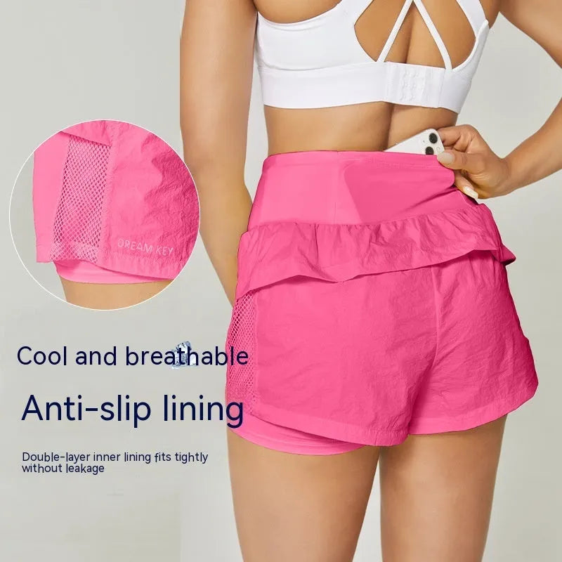 Women's loose-fit cotton blend quick-drying sports shorts in lemon yellow colour.