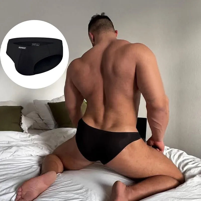 Men's solid colour seamless low-waist briefs on a white background.