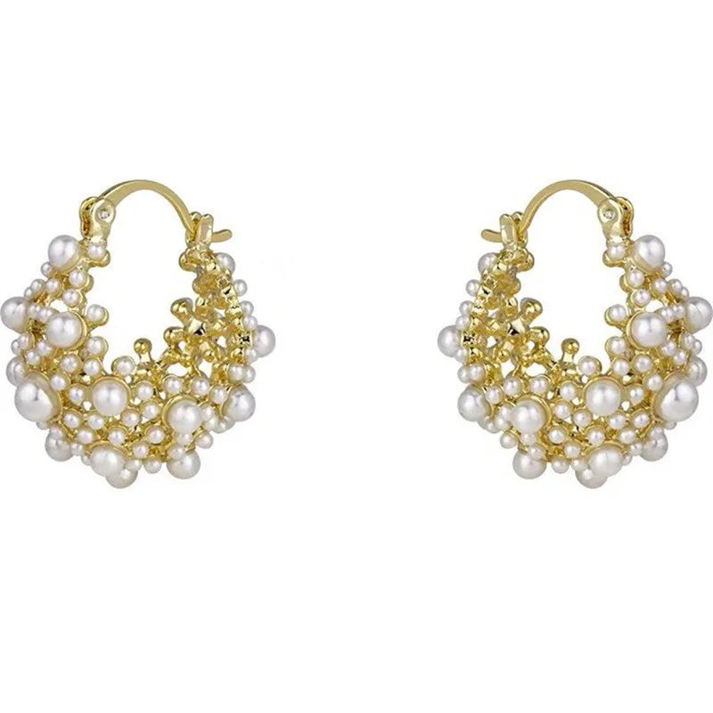 Gold coloured women's flower basket earrings with pearl inlay and small rice-shaped bead details.