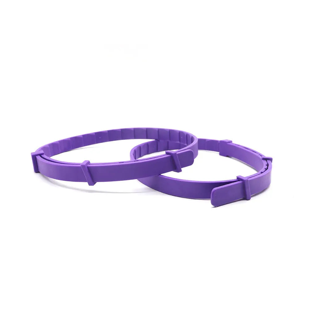Pack of four monochrome coloured TPR dog anxiety relief collars with adjustable 62cm sizing.