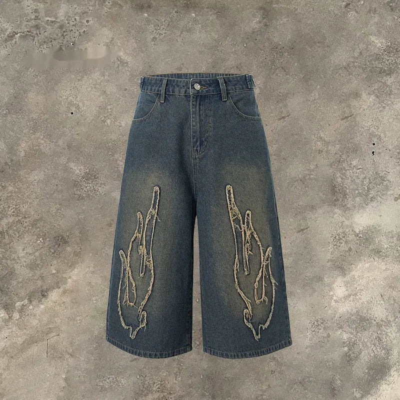 Cropped men's denim shorts with flame embroidery patch in straight-leg cut for summer street style