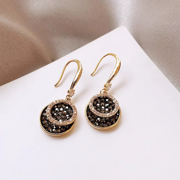 Black geometric alloy earrings with round piece in retro Hong Kong style, 3.6cm long.