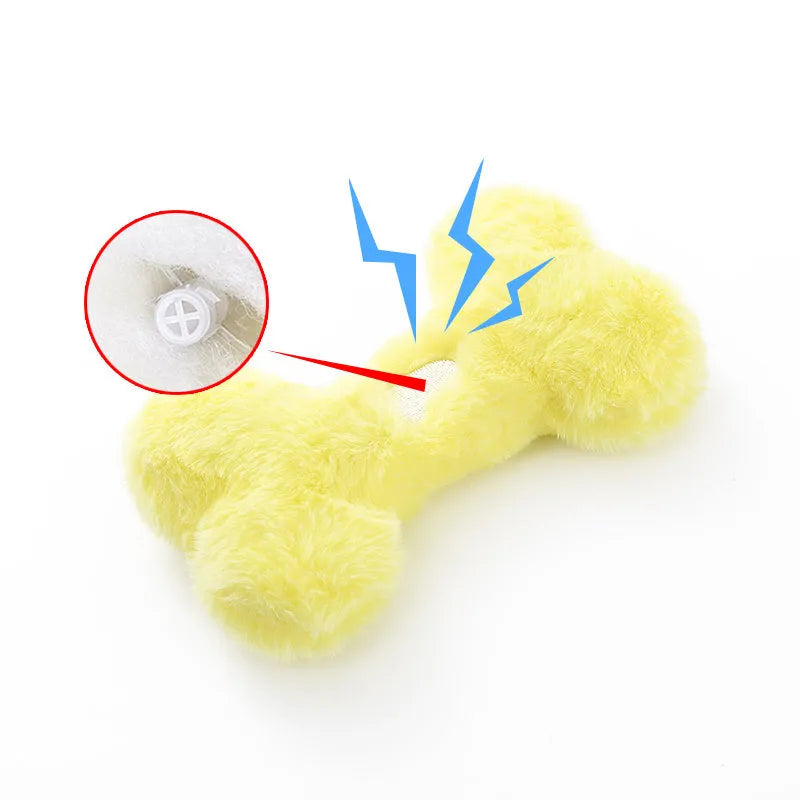 Soft plush dog toy shaped like a bone with a love heart design, in blue colour with a squeaker.