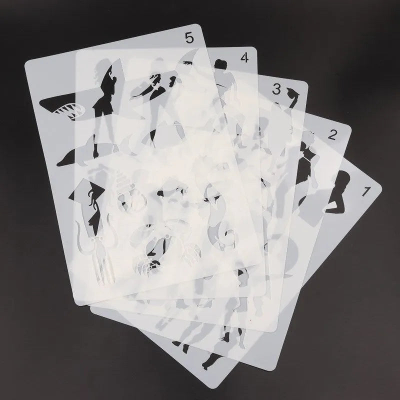 White drawing stencil set showing assorted artistic patterns including geometric shapes and mandala designs