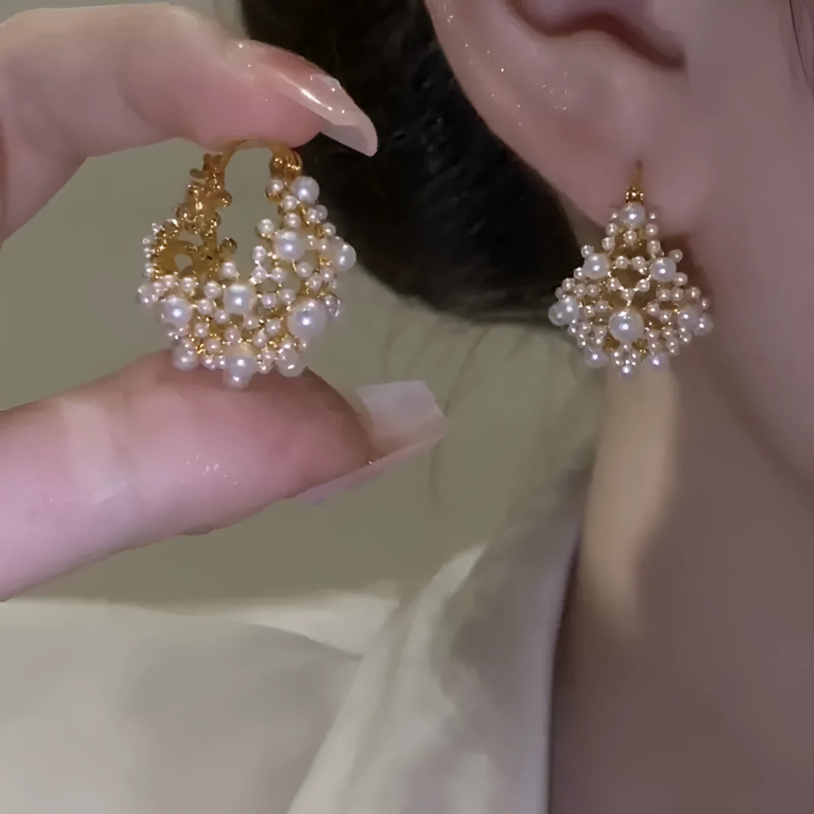 Gold coloured women's flower basket earrings with pearl inlay and small rice-shaped bead details.