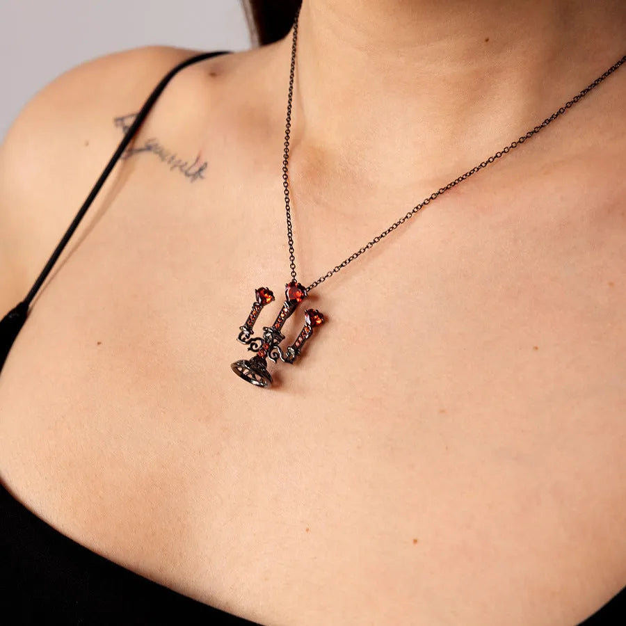 Women's zinc alloy clavicle necklace with a hollow retro candlestick pendant on a cross chain.
