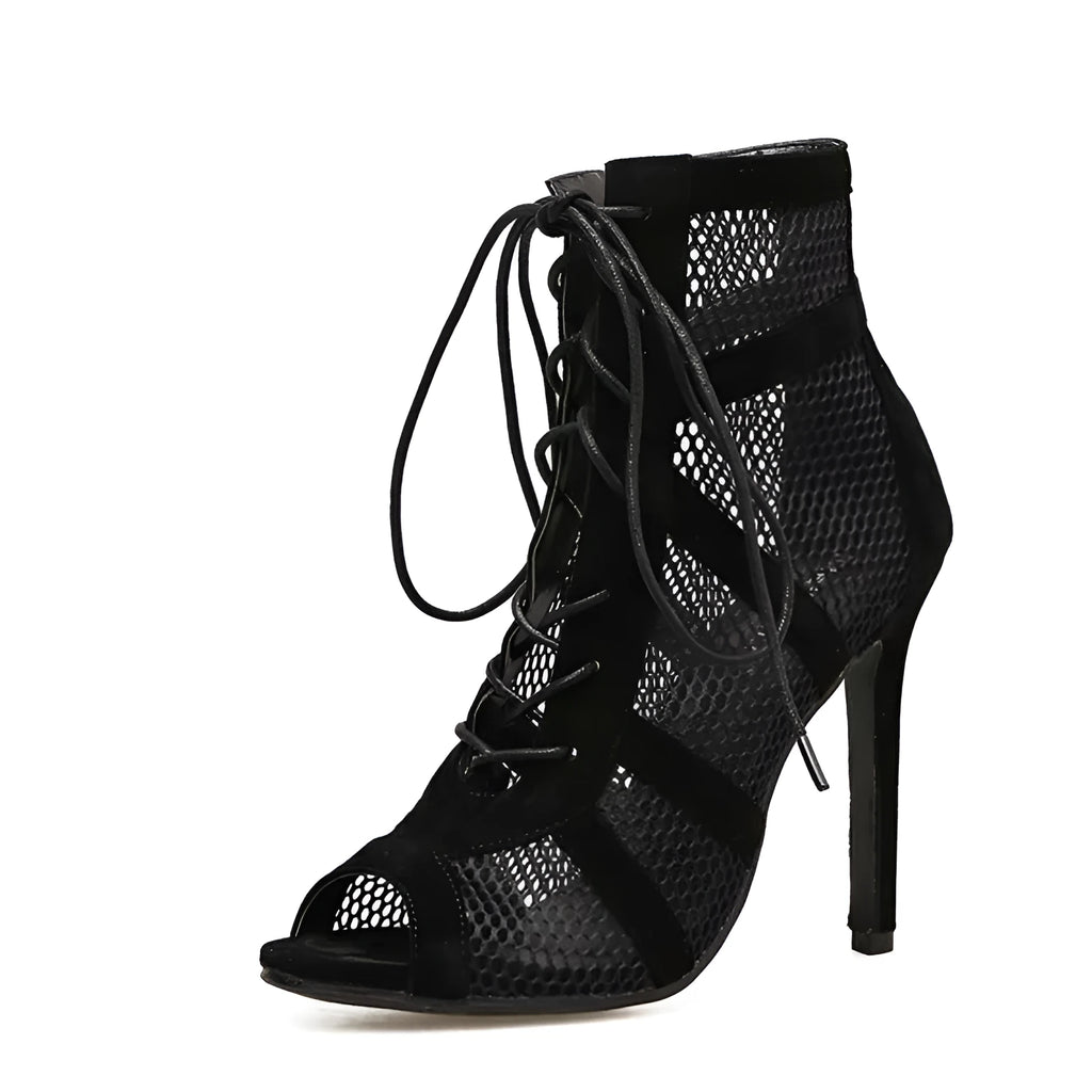 Black suede women's lace-up high heel shoes with a tall heel on a white background.