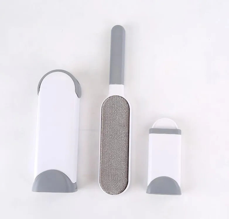 Blue reusable pet hair remover brush with self-cleaning base for removing fur from a grey sofa.