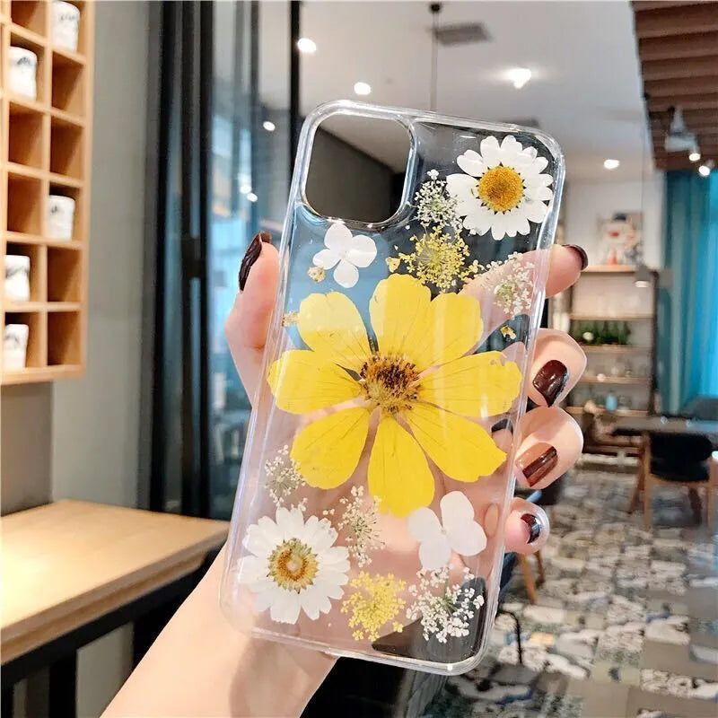 Floral patterned TPU phone case for iPhone showing large pink and yellow flower designs on back cover