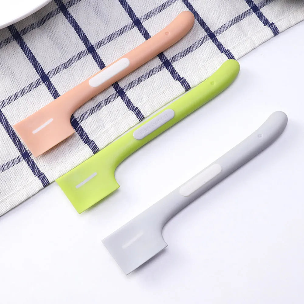 Green, pink, and purple long-handled pet food scoop for canned cat and dog food