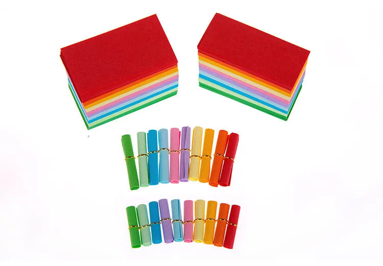 Assortment of colourful mini paper scrolls with metal eyelets for drift bottle messages and crafts.
