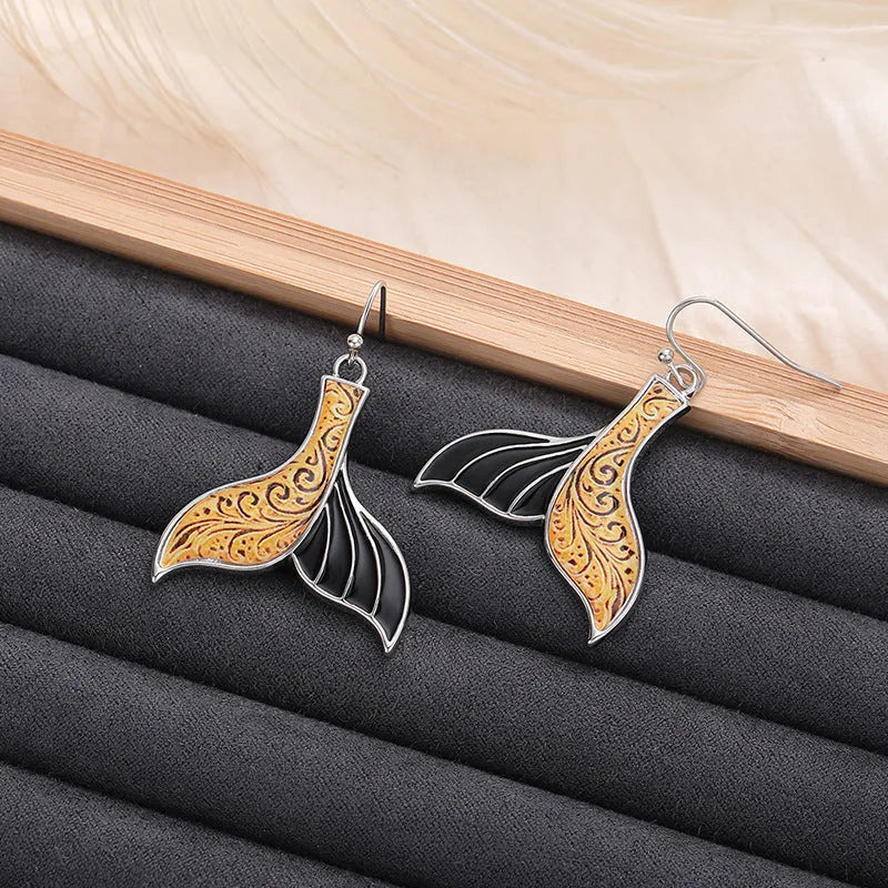 Women's retro whale fishtail alloy earrings in white gold colour, approximately 3cm length