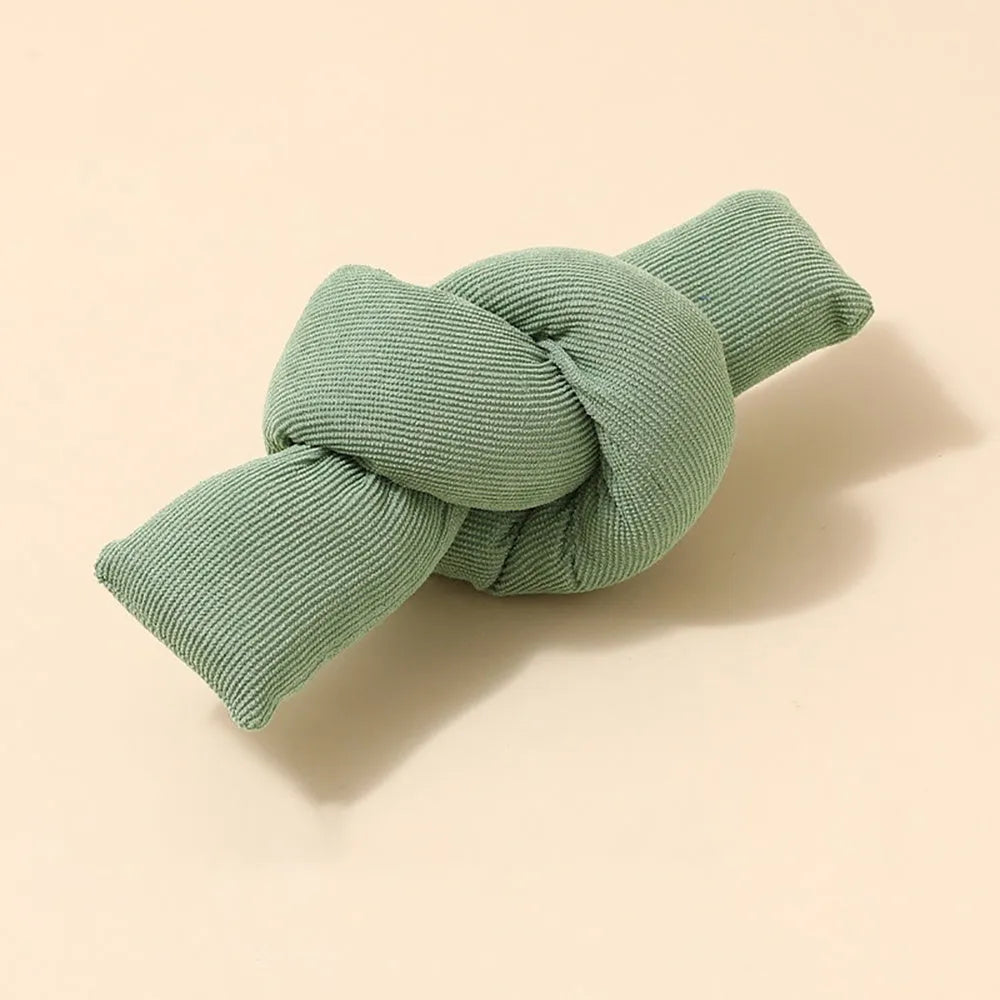 White natural cotton dog rope toy with hand-tied knots for tug play and dental flossing