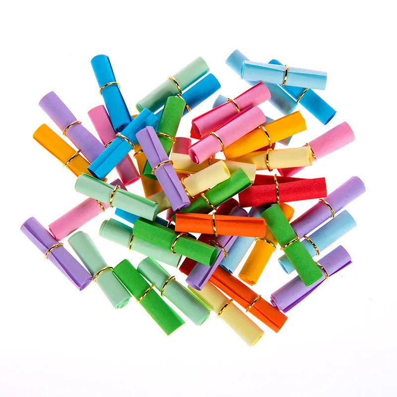 Assortment of colourful mini paper scrolls with metal eyelets for drift bottle messages and crafts.