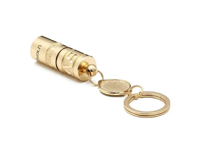 Gold-coloured waterproof zinc alloy portable LED flashlight on a keychain ring.