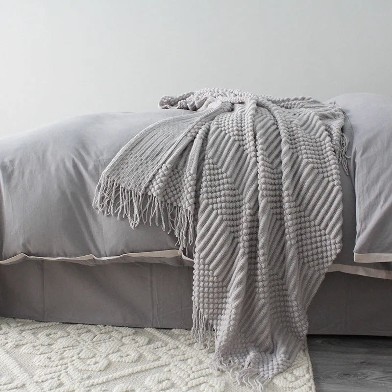 Small polyester nap blanket in dark grey, khaki, or light grey colours showing 127x170cm dimensions