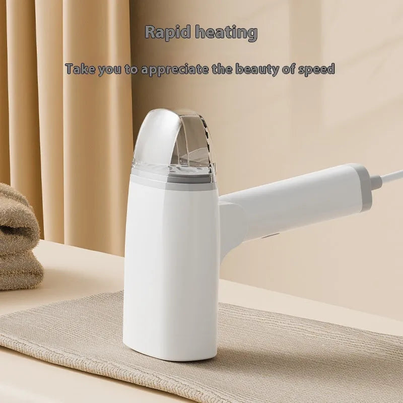 Handheld garment steamer in blue colour showing compact design with water tank