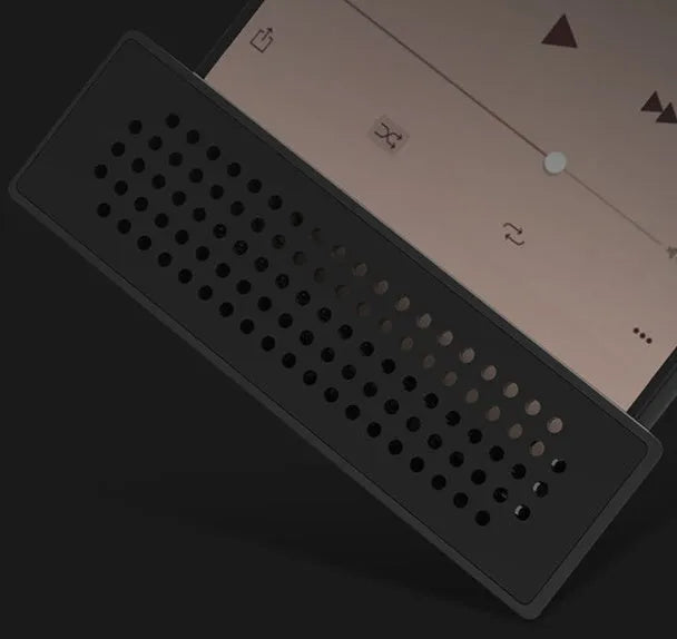 A portable black ABS mobile phone amplifier bracket holding an iPhone to boost sound for desktop use.
