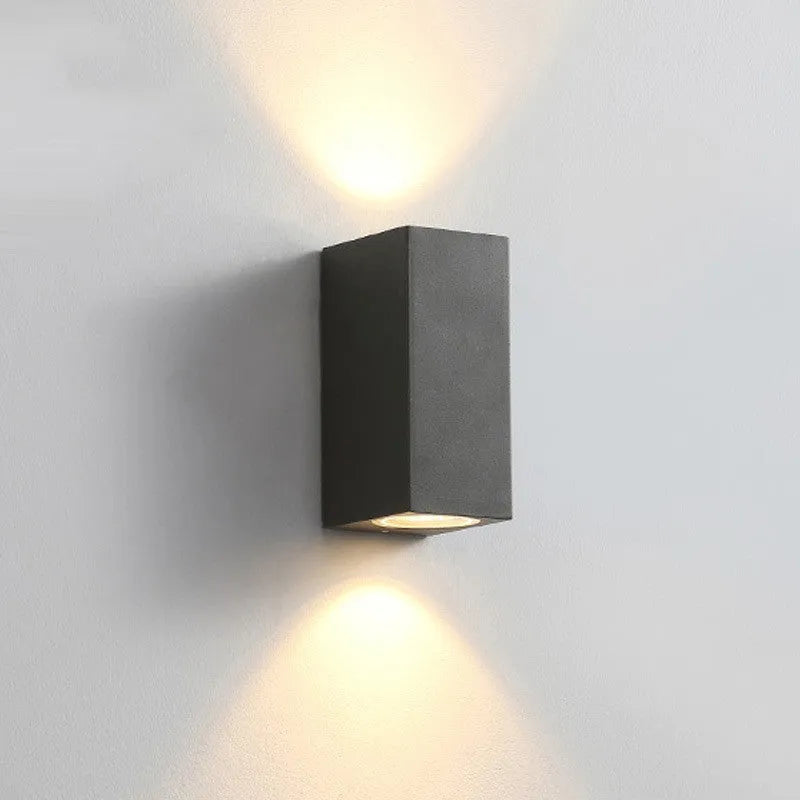 Black aluminium wall lamp with silicone rubber trim and glass elements