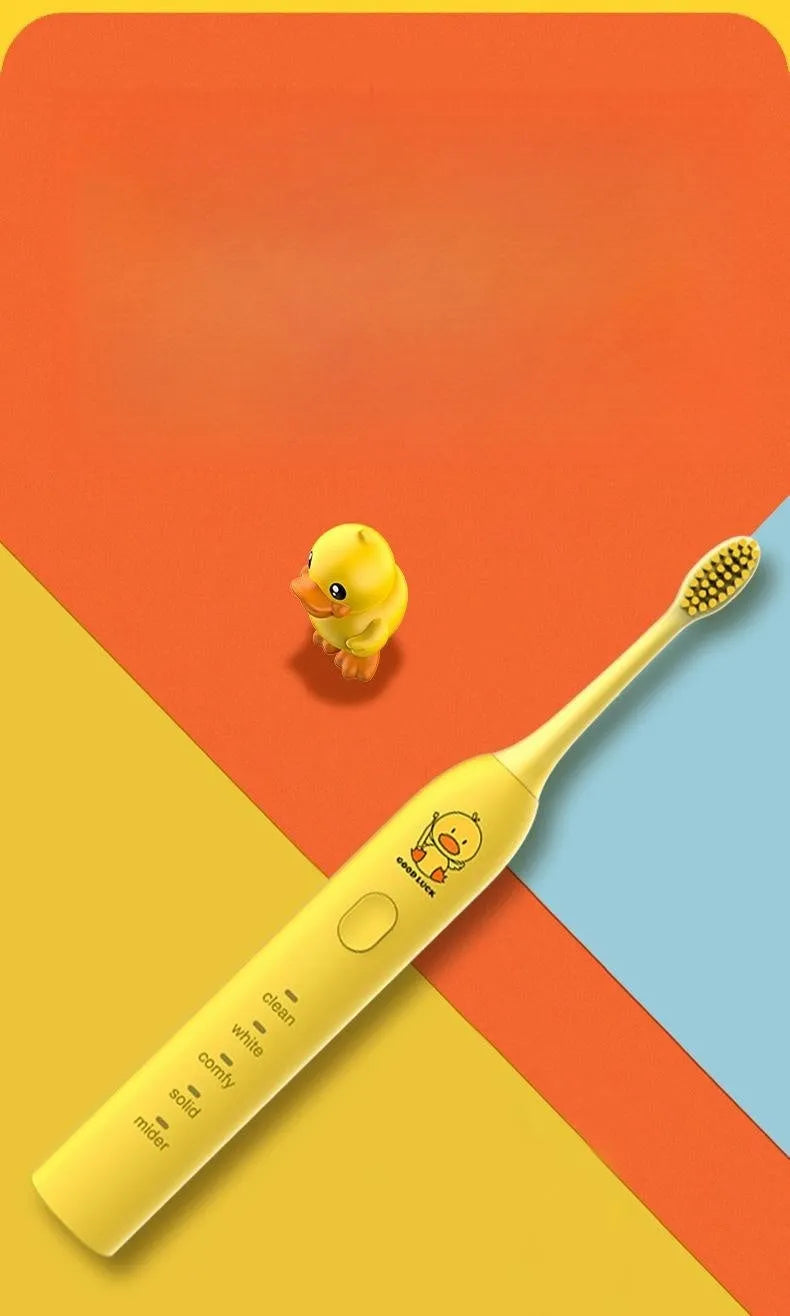 Rechargeable electric toothbrush in yellow with small duck design showing soft bristle brush head