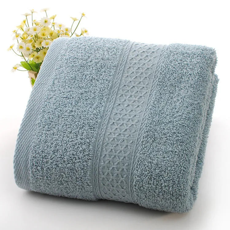 Thickened cotton blend bath and beach towel shown in multiple colour options including green, blue, and pink variations.