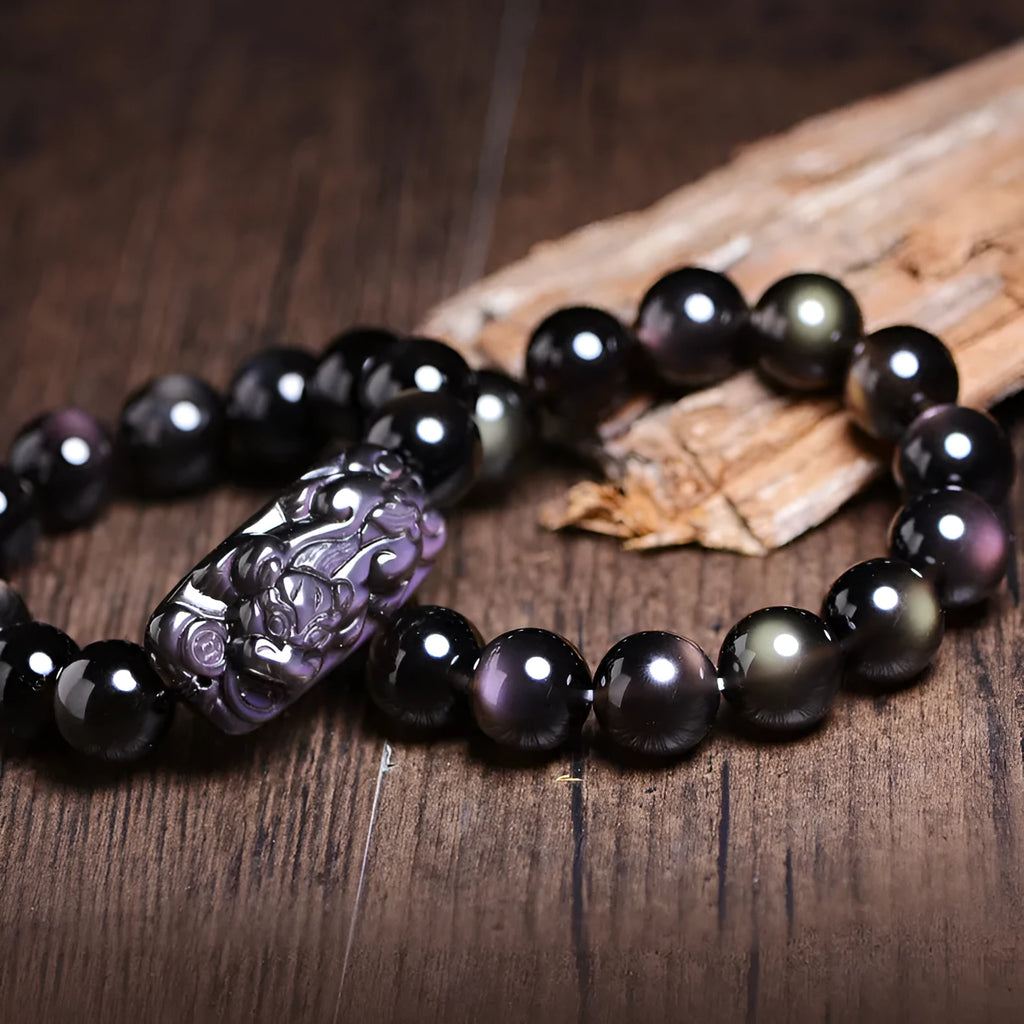 Natural crystal Pi Xiu bracelet with geometric ethnic design in ice stone colours