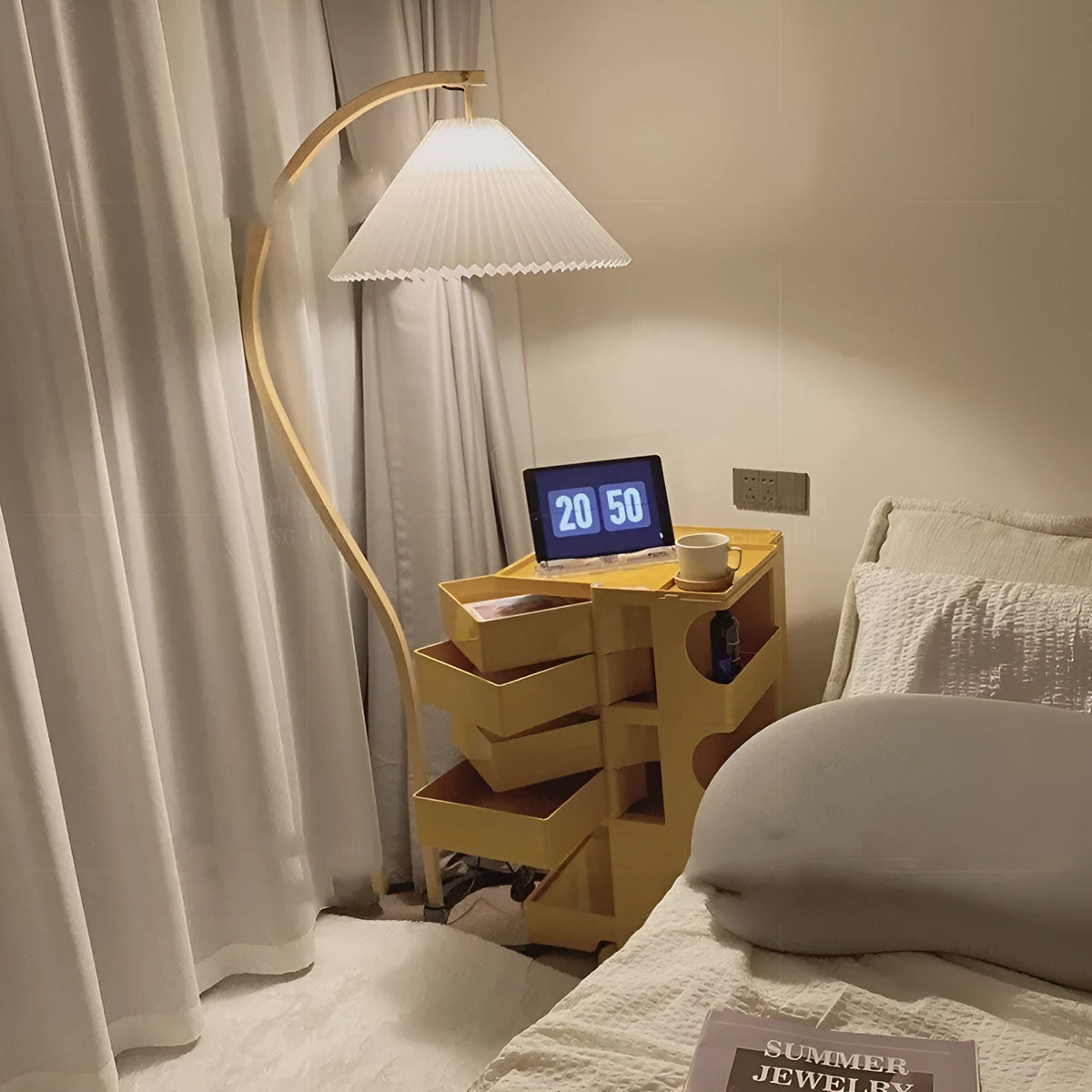 Retro-style vertical table lamp with log white lampshade placed on a sofa arm.
