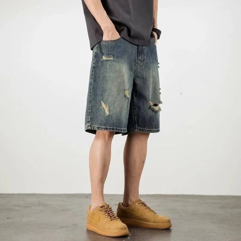 Blue retro distressed denim men's shorts with loose hole detailing and straight cut