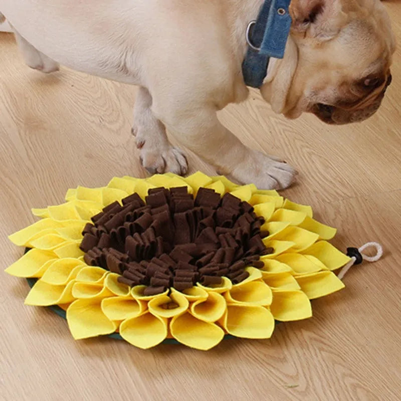 Yellow sunflower-shaped dog snuffle mat with fleece petals for treat hiding and slow feeding