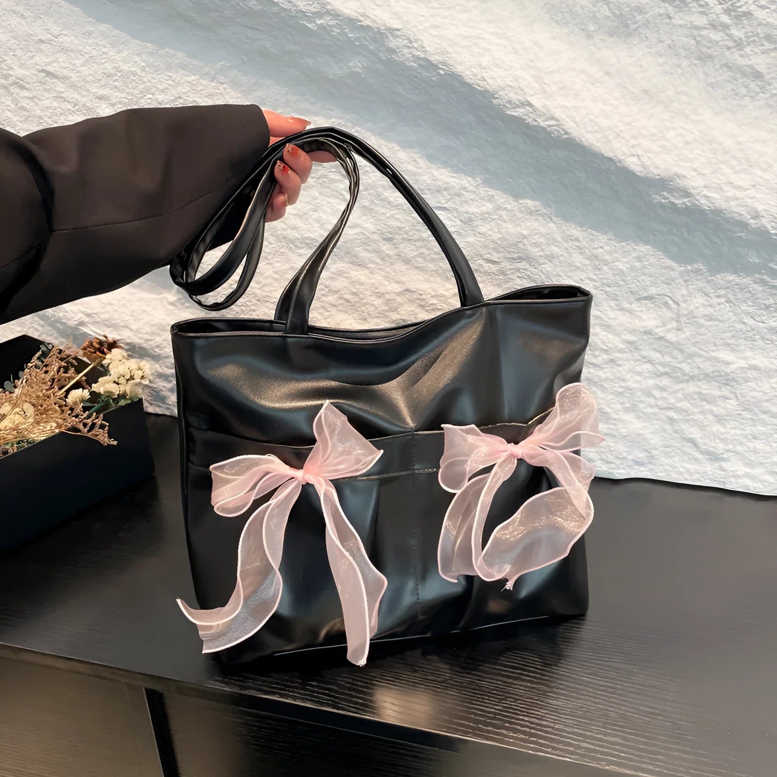College style bow tote bag in black or pink with double shoulder straps and zippered compartment