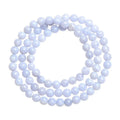Blue agate beaded bracelet with multi-circle patterns and Ruyi design elements on a wrist.